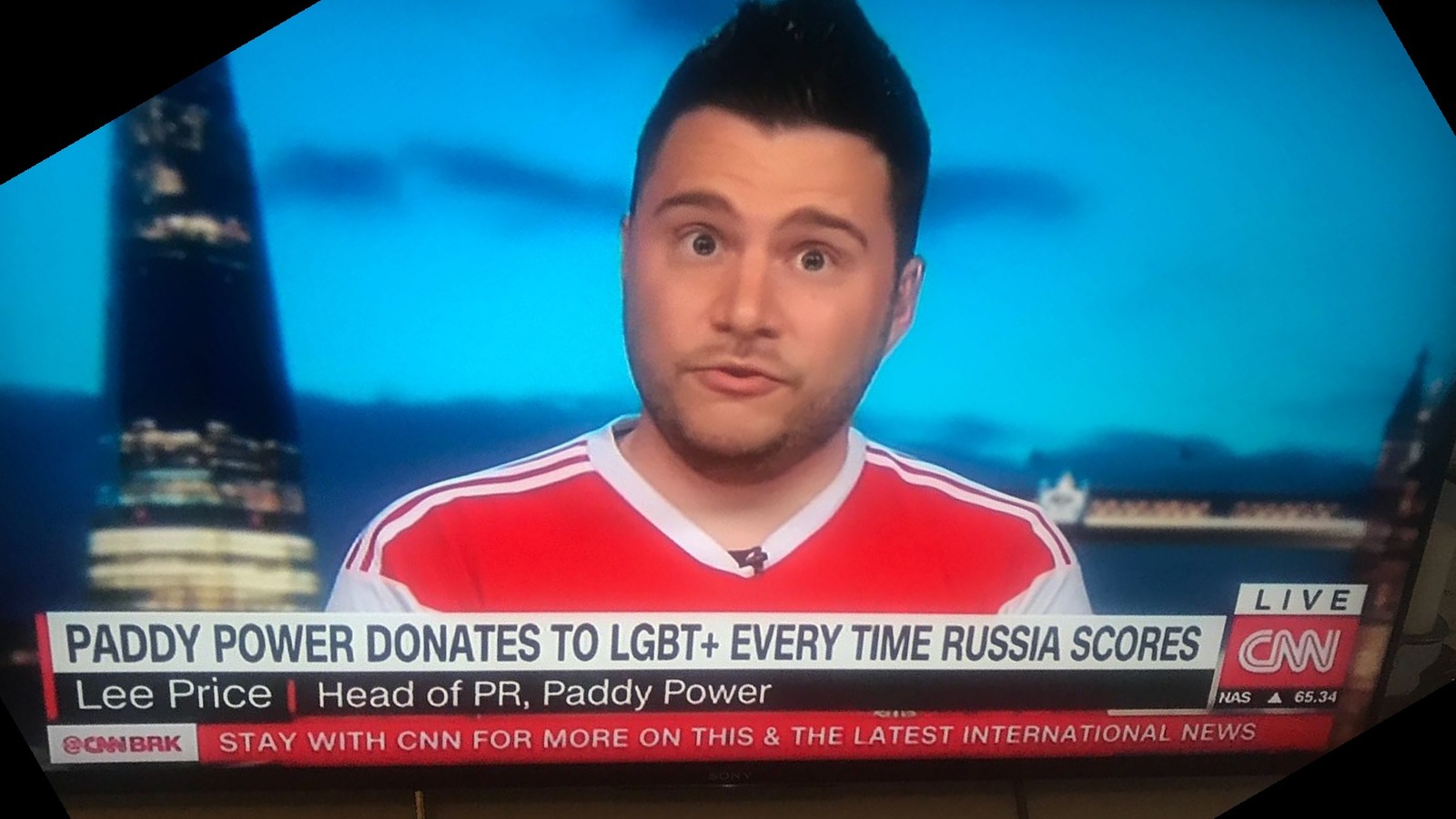 Lee Price live on CNN, wearing a Russia football shirt, discussing the Rainbow Russians campaign the morning after Russia's 5-0 opening win against Saudi Arabia.