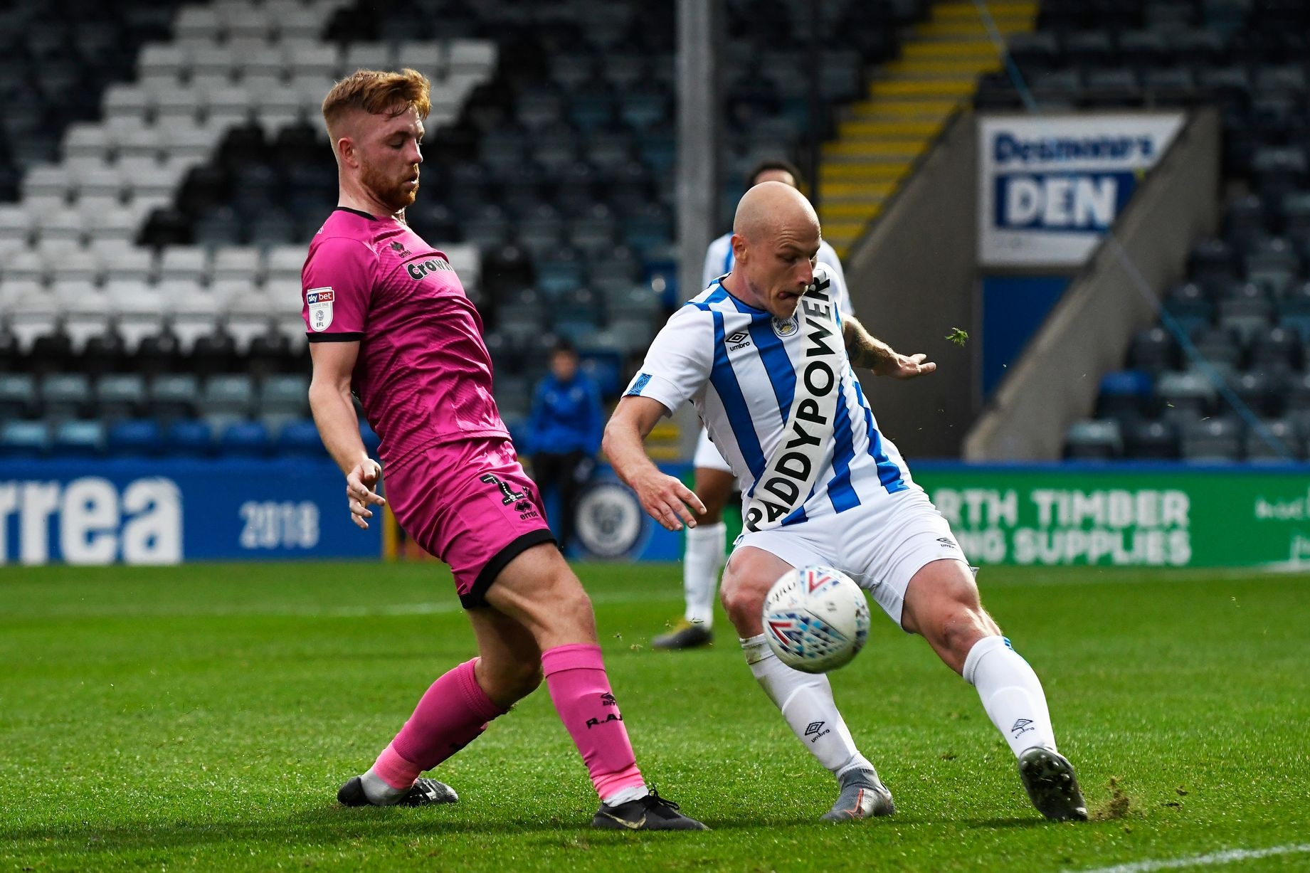 Huddersfield Town's Aaron Mooy controlling the ball in the over-branded Paddy Power kit during the Rochdale friendly.
